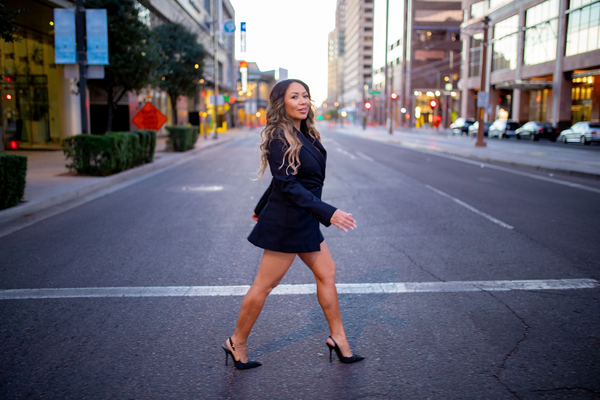 Amy Owen crossing a downtown Phoenix street